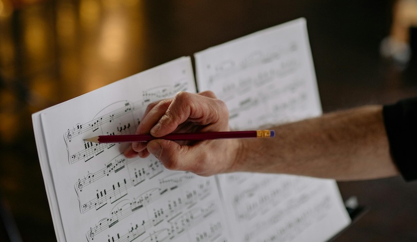 lessons a hand writing on sheet music